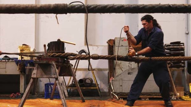 Wound up ... Anthony Longhurst prepares ropes for rigging the Endeavour replica, which will circumnavigate Australia next year.