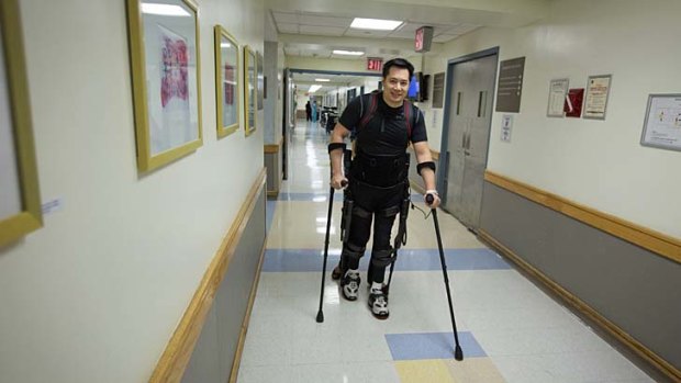 Robert Woo, 45, walks with the aid of the Ekso Bionics "exoskeleton".