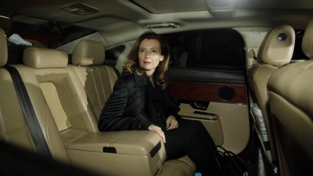 Valerie Trierweiler, former partner of French President Francois Hollande, looks on from a limousine after her arrival in Mumbai.