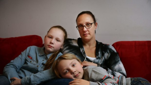 Jade Marr with her children Kendall, 10, and Jackson, 7, at their Warners Bay home.