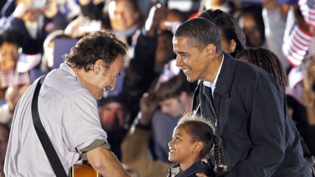Barack Obama introduces daughter Sasha to Springsteen.