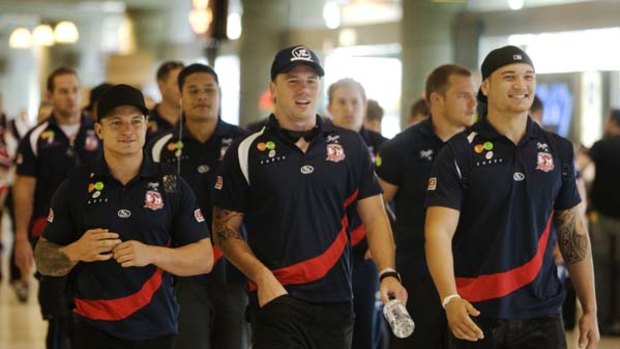 Ready for a grand final take-off ... the Sydney Roosters looked a united outfit on arrival at Sydney Airport after beating the Gold Coast Titans to earn a grand final spot.