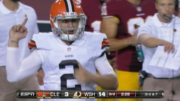 Johnny Manziel appears to make an obscene gesture towards the Redskins bench.