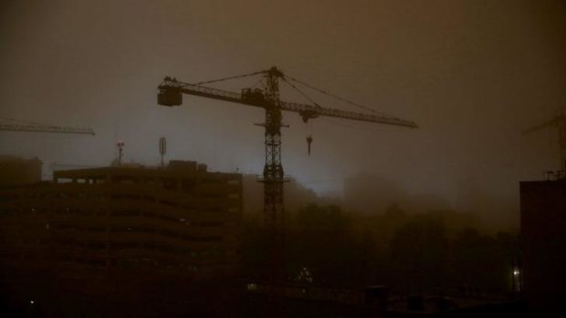 A tower crane is is enveloped in dust in Tehran, Iran on Monday as a sandstorm stings the city's residents with wind gusts up to 110 kilometre per hour.