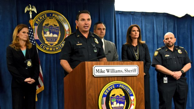 Jacksonville Sheriff Mike Williams, center, speaks during a news conference Friday, Jan. 13, 2017, in Jacksonville, Fla., where it was announced they found Kamiyah Mobley alive and well in South Carolina. Mobley was kidnapped from a Jacksonville hospital as a newborn 18 years ago. Police arrested Gloria Williams, 51, of Walterboro, S.C., at the home Mobley was living in and charged her with kidnapping and interference with custody. (Bob Mack/The Florida Times-Union via AP)