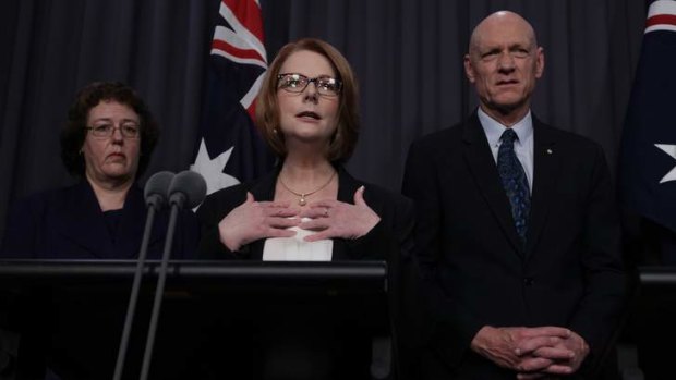 Parliamentary Secretary Jacinta Collins, Prime Minister Julia Gillard and School Education Minister Peter Garrett during a press conference at Parliament House in Canberra on Sunday.