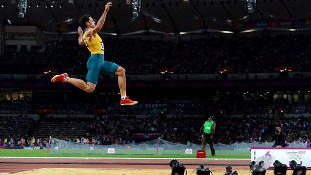 ''I'm happy, the head coach is happy. The only people that aren't happy are you guys [the media]'' ... Mitchell Watt launches himself during the long jump final.