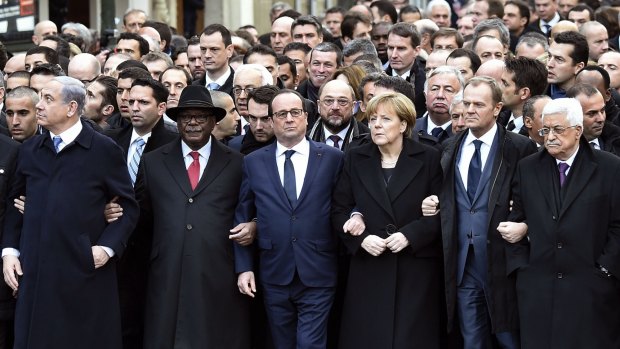 United front or hypocritical? World leaders walk arm-in-arm at the head of the Paris march on Sunday.