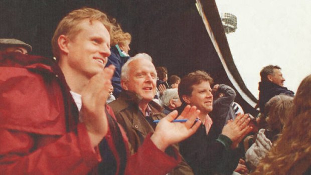 So near, yet so far &#8230; James Button (left) at the footy with his father, John (centre), in the 1990s.