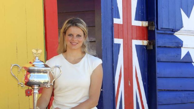 Shining star ... Kim Clijsters shows off the Australian Open trophy at Brighton Beach after her victory last year.