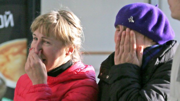 Relatives of the victims of a Russian airliner which crashed in Egypt arrive at Pulkovo airport in St Petersburg.