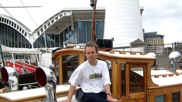 Chris Jagger sits on the launch built by his grandfather, Alfred Scutts, that now resides in the National Maritime Museum.