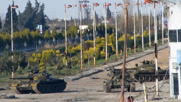 No ceasefire ... Syrian army tanks at the entrance to Baba Amr neighbourhood in Homs.