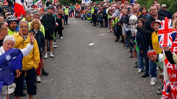 Hazardous &#8230; crowds line the steep and narrow route on the Mur de Peguere, where Cadel Evans and others came to grief after tacks were sprinkled on the road.