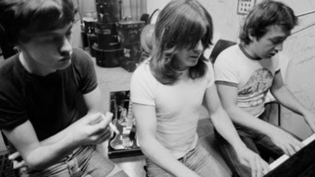 AC/DC producer George Young with brothers Malcolm and Angus.