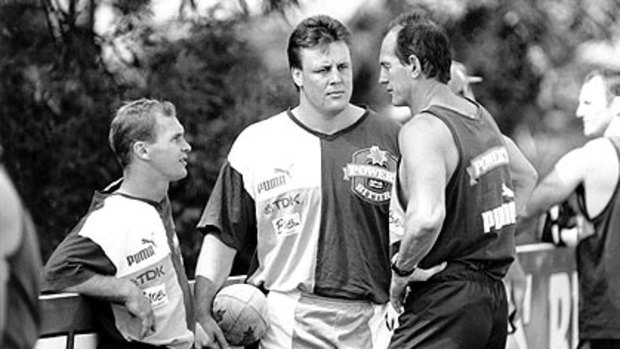 The spectre of foundation coach Wayne Bennett, pictured with Allan Langer and Glenn Lazarus, is as strong as ever at Red Hill.