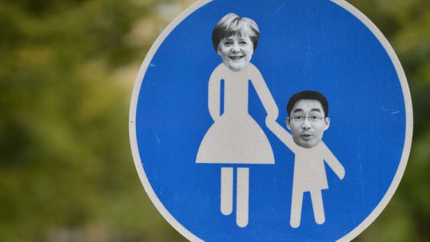 Portraits of Angela Merkel and Free Democrats leader Philipp Roesler on a sign in Berlin.