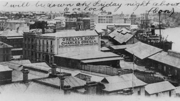 An O'Reilly's advertisement towers over Eagle Street Pier in the early 1900s.