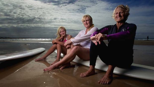 Sands of time: Abbey Mae (left), her mother Alison and grandmother Elaine Reid surf together at Byron Bay. "We were in the water before we could walk," Alison says.