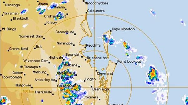 A radar image shows the line of severe storms spreading across southeast Queensland.