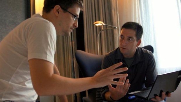 Edward Snowden talks with Journalist Glenn Greenwald in a scene from the documentary <i>Citizenfour</i>.