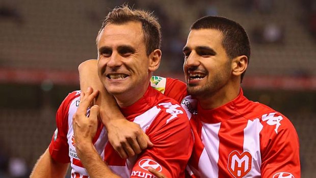 Up for the challenge: Heart's Richard Garcia and Aziz Behich in last week's win.