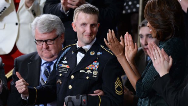 Standing ovation: US Army Ranger Cory Remsburg, wounded in Afghanistan, with First Lady Michelle Obama.