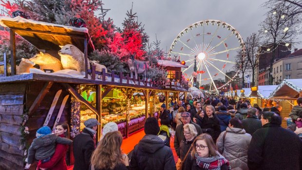People visit the Christmas market in Brussels on Saturday, Dec. 12, 2015. (AP Photo/Geert Vanden Wijngaert)