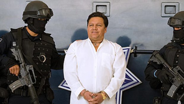 Smiling Bolivian priest Jose Mar Flores Pereira under arrest.