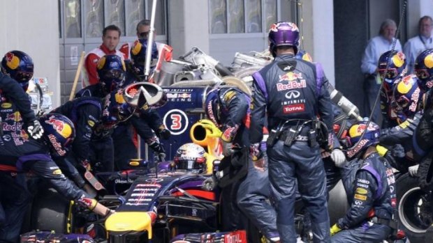 Mechanical machinations: Sebastian Vettel gets some pit-stop assistance during the Austrian F1 Grand Prix