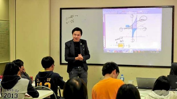 At the private tutoring college Breakthrough Education, in Glen Waverley, teacher Kevin Xiao takes a mathematics class.