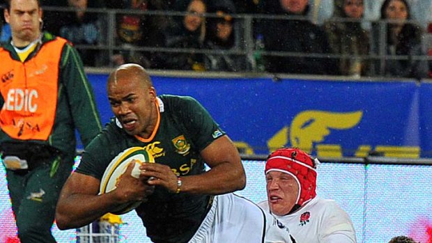 JP Pietersen of South Africa is tackled.