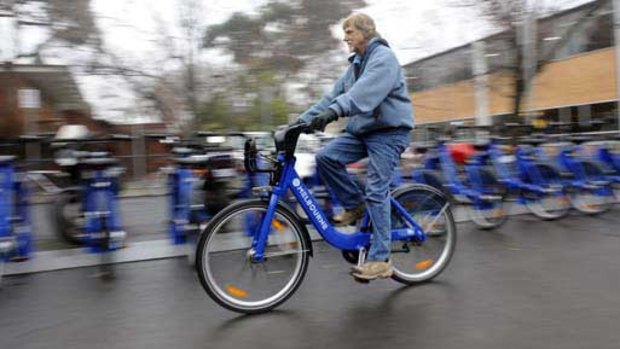 Mike Rubbo on a communal bike at Melbourne University.