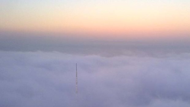 The Arts Centre spire pierces the fog in this picture taken the Eureka Tower.