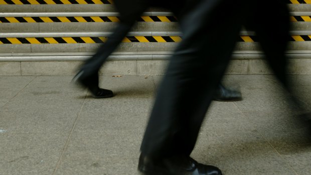 Business. Photo shows two businessmen walking. 25 May 2005. AFR Photo by Andrew Quilty. Generic business, risk, risky business, hazard, hazardous, corporate, corporation, fraud, danger, caution. SPECIALX 37052