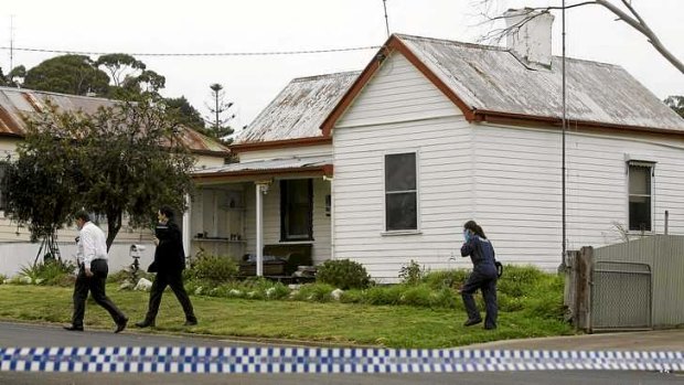 Police on the scene of the multiple fatal stabbing in Casterton in 2011.