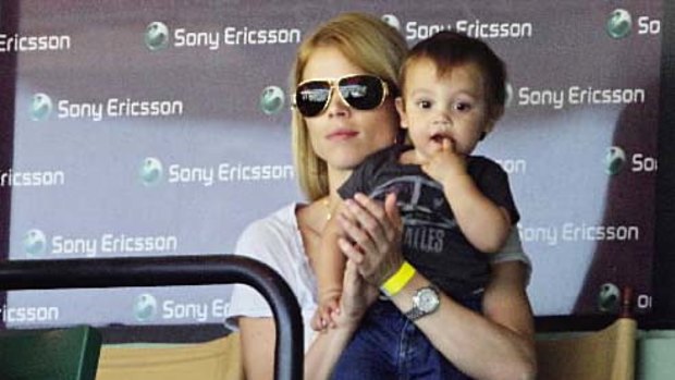 Cheer squad... Elin Nordegren and son Charlie watch a semi-final match between Rafael Nadal and Andy Roddick.