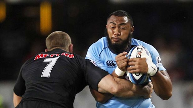 Deysel power ... Sekope Kepu of the Waratahs is tackled by the Sharks' Jean Deysel in Saturday's clash.