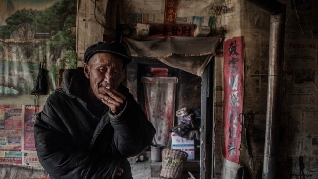 Li Zhi, receives less than $100 a year from the government and lives off handouts from tourists and tips he earns by collecting rubbish in Chashan, China.