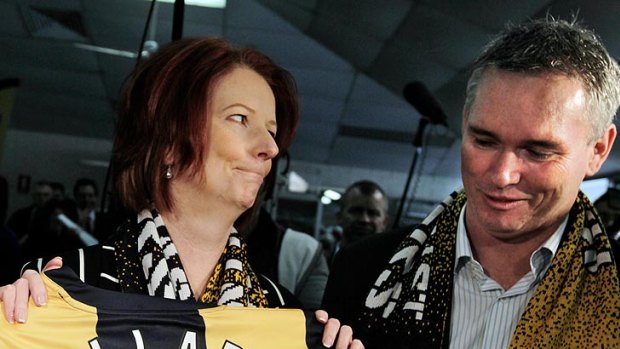 As they were ... Julia Gillard and Craig Thomson campaigning on the NSW central coast in August last year.