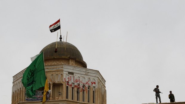 Iraqi security forces on the gate of Tikrit.