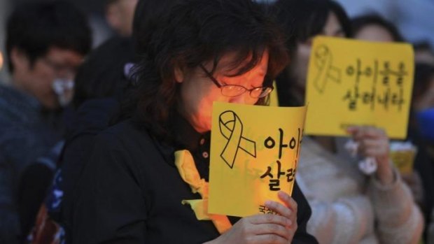People pay tribute to the victims of the sunken ferry in Seoul, South Korea.