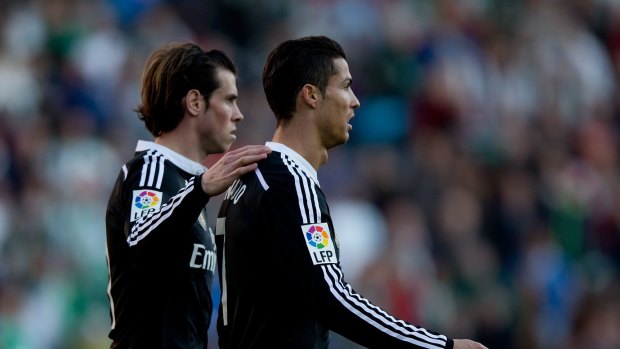Ronaldo, right, is consoled by teammate Bale.
