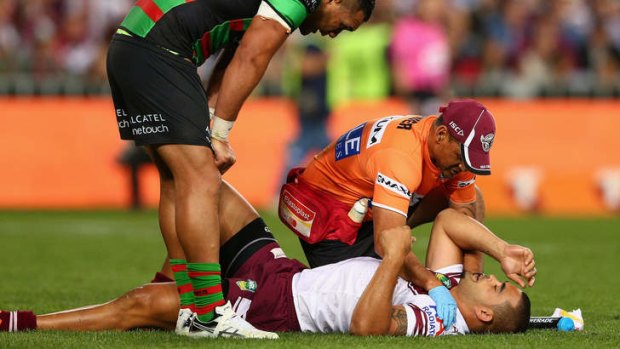 Down for the count: Richie Fa'aoso lies prone on the ANZ Stadium turf after a heavy collision during the preliminary final against South Sydney on Friday night left him with a fractured neck.