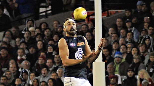 Andrew Walker uses Bomber Jake Carlisle as a stepladder to take a spectacular marks.