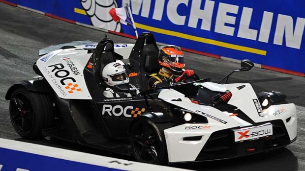 French F1 driver Romain Grosjean (right) competes in the Race of Champions at Rajamangala Stadium in Bangkok.