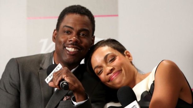 Chris Rock with his <i>Top Five</i> co-star Rosario Dawson in Toronto.