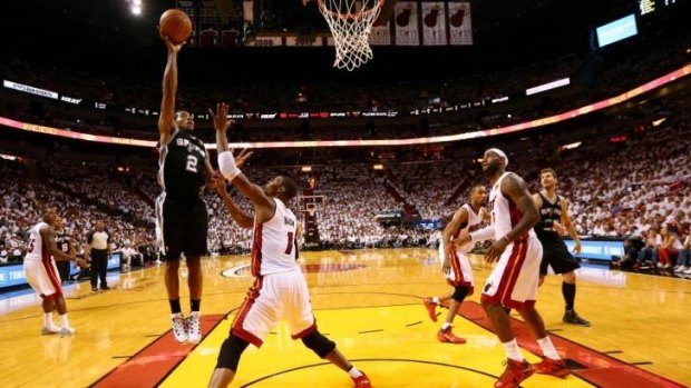 Hot hand ... Kawhi Leonard of the San Antonio Spurs takes a shot over Chris Bosh during game 3.