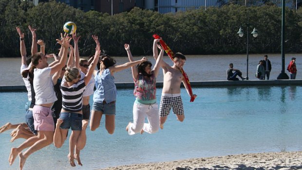 Beachgoers defy the cold weather for the reopening of South Bank's main pool over the weekend.