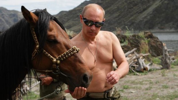 Vladimir Putin feeds a horse during a trip to Siberia in 2009.